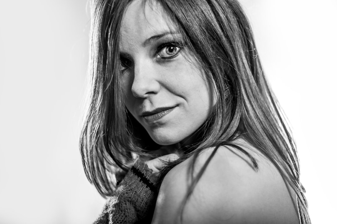 Argentine woman in her thirties smiling, studio portrait