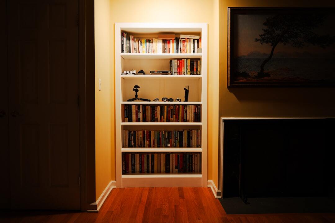 Shelves filled with hardcover books in a dim reading room