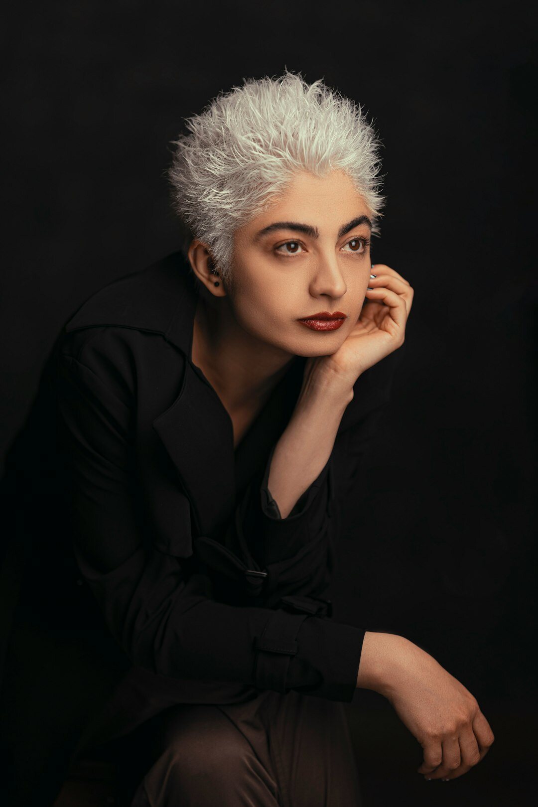 Argentine woman in her fifties with short gray hair, studio portrait