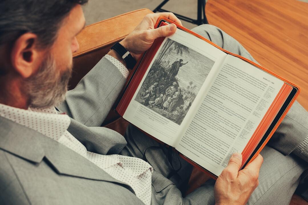 Argentine male author in his forties wearing a blazer, seated in a study